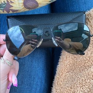 All black RayBan aviators